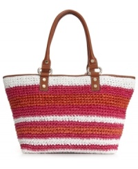 An adorable straw shopper with cheerful stripes. This DKNY style is great for the beach or the city, featuring vibrant colors and luxe leather trim.