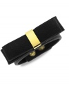 BCBGeneration makes a subtle, but bold statement with this snap bracelet. With details crafted from gold-tone mixed metal, the bracelet features a bow on top for a fashionable touch. Approximate length: 8 inches.