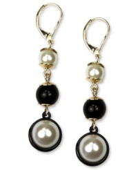 Line up your new look. Anne Klein's linear earrings offer sophistication through plastic pearls and black tone ruthenium accents. Set in a gold tone mixed metal setting with a leverback closure. Approximate drop: 1-1/2 inches.