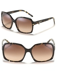 Hit the streets in chic oversized sunglasses with signature metal logo detail along arms from Fendi.