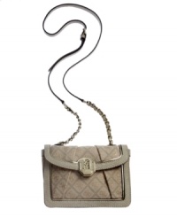 Lady-like and lovely, this petite yet surprisingly spacious silhouette from GUESS goes from deskside to dinner date in a wink. Graphic 4-G pattern and signature golden hardware lend a luxe look, while the well-organized interior stows phone, wallet and makeup with ease.