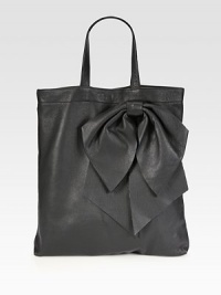 Sumptuous calfskin shaped by an oversized bow for a unique silhouette.Double top handles, 6½ dropTop snap closureInner zip pouchSuede lining13¼W X 15½H X 2DMade in Italy