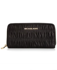 Before your next continental excursion, be sure to pack this pleated design from MICHAEL Michael Kors that provides plenty of pockets and compartments for cash, cards, coins and ID, while signature hardware gives the look luxe appeal.