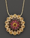 A glittering burst of 14K yellow gold, set with citrine, smokey quartz and garnet.