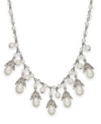 Lauren by Ralph Lauren goes for classic cool with this necklace. Crafted from silver tone brass, the link necklace features an array of glass pearls for an elegant touch. Approximate length: 18 inches. Approximate drop: 1/2 inch.