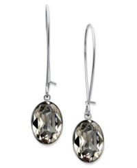 A splash of smoky color from Swarovski. A bezel-set, oval-cut Greige crystal offers a lovely backdrop on these drop earrings. Crafted in rhodium-plated mixed metal. Approximate drop: 1-3/4 inches.