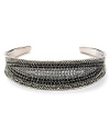 Crystal stones dress up this Judith Jack cuff and offer a glamorous complement to its striking sterling silver setting.