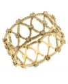 Lovely in lattice. This bangle bracelet from 2028 blends timeless elegance with modern appeal with glass accents and intricate openwork detail. Crafted in gold tone mixed metal. Approximate length: 7 inches.