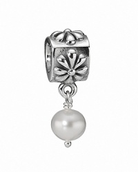 A floral sterling silver charm featuring a classic white freshwater pearl. By PANDORA.