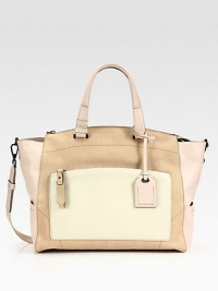 A colorblocked leather style in a soft, roomy frame; perfect for all your essentials.Double top handles, 6½ dropDetachable shoulder strap, 15½ dropTop zip closureProtective metal feetOne outside zip pocketThree outside open pocketsOne inside zip pocketTwo inside open pocketsCotton lining14½W X 12½H X 6DImported