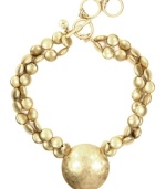 Get glam with an instant gold rush. Jones New York's chic collar necklace dazzles in gold tone mixed metal discs with a large disc pendant. Approximate length: 17 inches + 2-inch extender. Approximate drop: 1 inch.