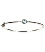 Layer-able style that adds a touch of shimmer. Judith Jack's thin, stackable bangle features a pear-cut blue topaz (1/4 ct. t.w.) and glittering marcasite in sterling silver. Approximate diameter: 2-3/8 inches.