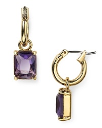 These elegant Carolee earrings feature a bright purple stone, adding a pop of personality to the traditional hoop design.