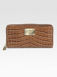 Chic and luxurious crocodile embossed leather design with a logo plaque.Zip-around closureOne inside zip pocketEight credit card slotsTwo bill compartmentsFully lined8¼W X 4H X ¾DImported