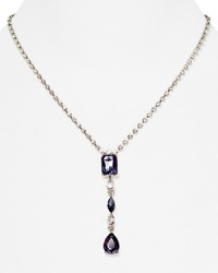 A delicate stone and crystal pendant is a glamorous focal point on this Carolee necklace, crafted of silver plated metal.