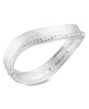 Make waves with this hinged bangle bracelet from Robert Lee Morris. Crafted from silver-tone mixed metal, the piece gets a lustrous addition by way of glass pave crystal accents. Approximate diameter: 2-3/8 inches.