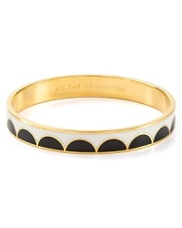 Deck your wrists in kate spade new york style with this bangle, engraved with a totally trim turn of phrase.