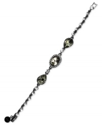 Subtle chic. Givenchy's flex bracelet is crafted from hematite-tone mixed metal with glass stones and cubic zirconia accents adding an elegant touch. Approximate length: 7-1/4 inches.