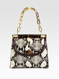 An illusion of luxurious proportions, this snake printed calf hair design is trimmed in smooth leather, glossy resin and radiant hardware.Resin chain shoulder strap, 8½ dropMagnetic snap flap closureOne zip and two open inner compartmentsOne inside zip pocketTwo inside open pocketsCanvas lining11W X 8H X 5DImported