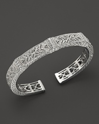 Intricate cutouts lend a unique look to this Judith Ripka cuff, accented with sparkling white sapphires.