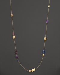 Stations of amethyst and topaz mix with hand-engraved 18K yellow gold in this statement necklace from Marco Bicego.