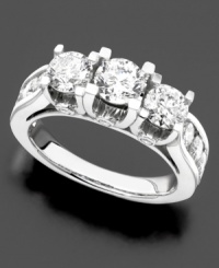 A three stone diamond ring with sophisticated details. Three-round cut diamonds are set in 14k white gold and accented with glittering, round-cut diamonds along the shank (3 ct. t.w.).