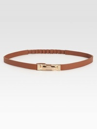 Waist defining and beyond chic, this leather skinny belt is flawlessly complemented by a brass buckle.Brass buckleLeatherLength, 27Width, ½Imported