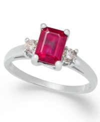 A cut above the rest. This stunning three-stone ring highlights an emerald-cut ruby (1-1/5 ct. t.w.) highlighted on either side by a round-cut diamond (1/5 ct. t.w.). Set in 14k white gold.