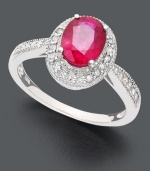 A pink-tinged ruby takes center stage on this heartwarming ring. Oval-cut ruby (1-1/2 ct. t.w.) in 14k white gold setting encrusted with round-cut diamond (1/4 ct. t.w.).