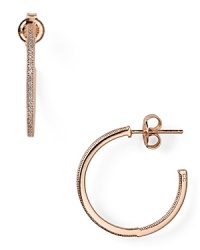 Rimmed in cubic zirconia stones, Crislu's rose gold-finished hoop earrings are a classic choice whether worn with denim or more swank with a little black dress and heels.