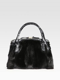 Be indulgent with this mink design accented with luxurious crocodile skin.Double crocodile skin top handles, 5 dropMagnetic top closureFive inner compartments; three zippered and two openOne inside zip pocketThree inside open pocketsSuede lining12½W X 10H X 4½DImported