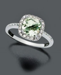 Indulge in gorgeous, green luxury. Cushion-cut green quartz (1-1/4 ct. t.w) takes on the sparkle of saltwater alongside round-cut diamond accents (1/10 ct. t.w.). Victoria Townsend ring crafted in sterling silver. Size 7.