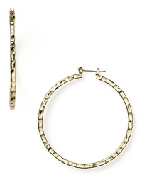 Opt for high-impact basics like this pair of gleaming faceted hoop earrings from RJ Graziano. This hammered pair are a jewel box staple that you'll reach for again and again.