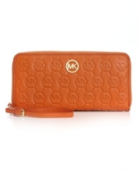 A timeless style that will remain gorgeous for seasons to come. This embossed monogram wallet from MICHAEL Michael Kors will keep you organized and fabulous with plenty of interior features and shiny 18K goldtone detailing.