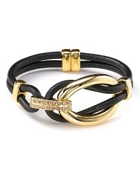 T Tahari makes a mixed material statement with this gold-plate and leather bracelet, boasting a bold contrast of tone and texture.