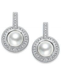 The timeless look of elegance. Eliot Danori's drop earrings feature framed simulated pearls (8 mm) with genuine mother-of-pearl coating encircled by crystals accents. Set in rhodium-plated mixed metal. Approximate diameter: 1/2 inch.