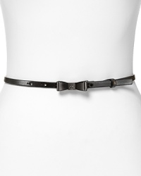 Add a cheeky twist to everyday ensembles with a whimsical bow belt from Tory Burch.