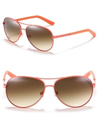 A tangerine hue heats up classic aviators from kate spade new york.