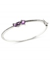 Elegance in amethyst. Judith Jack's bangle bracelet is crafted from sterling silver with marcasite (1/2 ct. t.w.) and amethyst-colored cubic zirconia (1-3/4 ct. t.w.) giving it a vibrant pop. Approximate diameter: 2-1/2 inches.