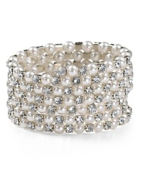 Detailed with sparkling rhinestones, Aqua's pearly coil bracelet lends a dressed up, sophisticated look.