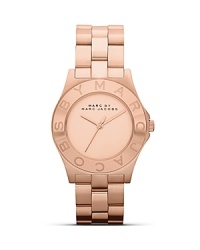 Perfect playful accessorizing with this watch from MARC BY MARC JACOBS. Crafted from rose gold plate with a logo-engraved bezel, this piece has style-setter written all over it.