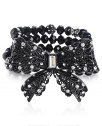 Wrapped up in a pretty package. This stretch bracelet from Betsey Johnson is crafted from black-plated mixed metal in a filigree pattern with rows of beads and glass crystal accents only enhancing the appeal. Approximate length: 7-1/2 inches.