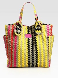 This vibrant carryall features signature letter stitching on printed nylon, complete with large over-sized pockets and knotted handles. Double top handles, 7½ dropMagnetic top closureTwo outside open pocketsOne inside zip pocketTwo inside open pocketsLogo-print lining14½W X 14½H X 4¼DImported