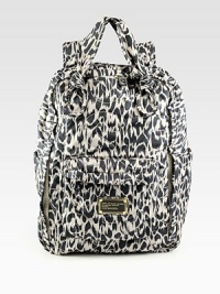 A lightweight nylon style in a fun abstract animal print with subtle logo topstitching.Double top handles, 5½ dropDouble adjustable shoulder straps, 8-12 dropTop zip closureTwo outside open pocketsOne outside zip pocketFully lined15W X 10¼H X 6½DImported