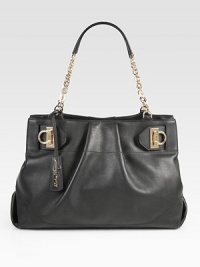 Ultra-luxe Italian leather with delicate pleats and cinching at the sides, adorned with a gleaming chain strap. Double chain shoulder straps, 8½ dropMagnetic snap closureProtective metal feetOne inner zip compartmentOne inside zip pocketTwo inside open pocketsFully lined15W X 10½H X 5½DMade in Italy