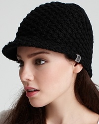 This sporty knit hat with brim is perfect for the slopes on a snowy day.