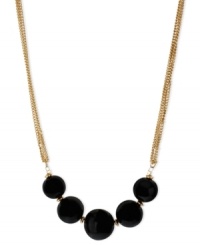 Black isn't back, but rather it's front and center in this frontal necklace from Kenneth Cole New York. Suspended from chains crafted from gold-tone mixed metal are black semi-precious beads. Glass pave accents add luster. Approximate length: 16 inches + 3-inch extender. Approximate drop: 3/4 inch.