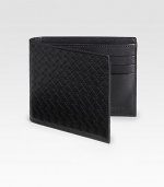 EXCLUSIVELY AT SAKS. Sophisticated with a sporty feel, in a classic leather logo stamped design.One billfold compartmentSix card slots4½ x 3½Made in Italy