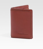 Bifold design crafted of rich Italian leather with topstitching and logo detail. Two card slots Two inside compartments ID window 3W X 4H Made in Italy 