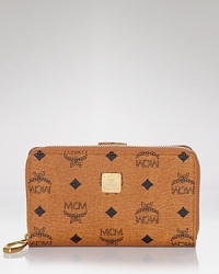 No purse is complete without the right wallet, and MCM's logo-splashed style is an edgy-glam choice. Cleverly designed with multiple pockets, it's an effortless essential.